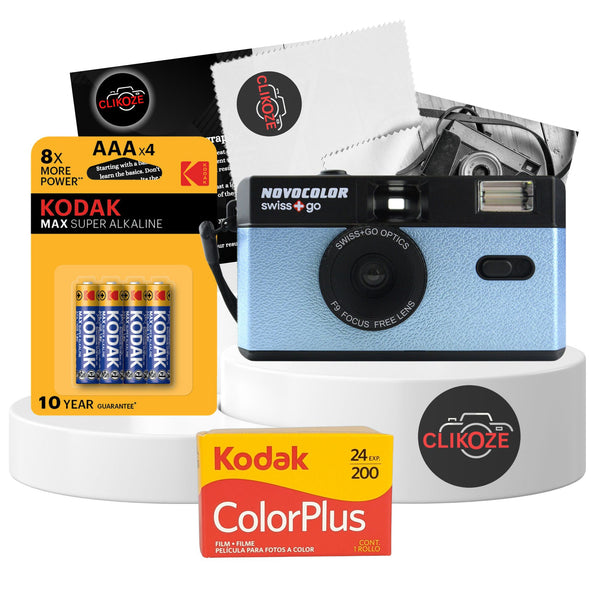 Blue Swiss+Go Novocolor reusable 35mm film camera with Kodak Colour Plus film, AAA battery, and photography tips card; perfect for capturing analog photos with built-in flash and wide-angle lens.